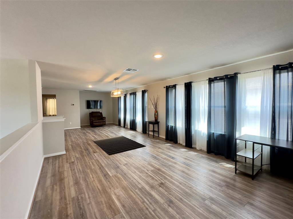 Spacious and airy loft with abundant natural light, perfect for a versatile living space or home office.