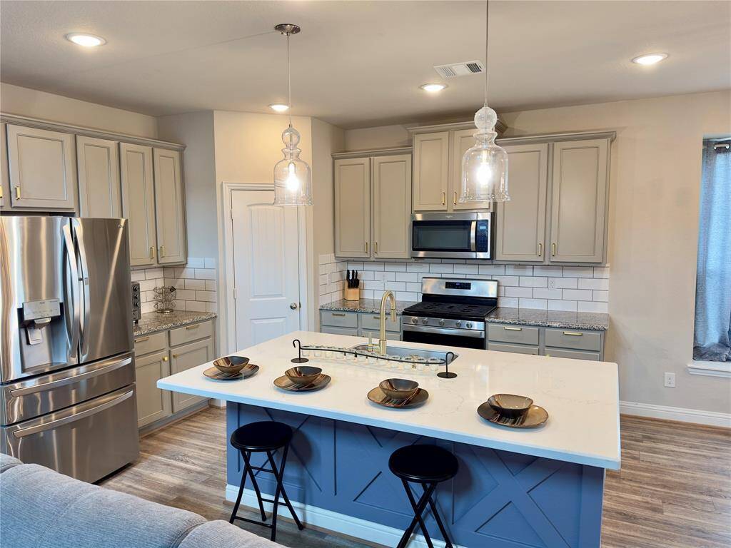 Luxurious kitchen featuring a sleek center island for ultimate culinary creativity.