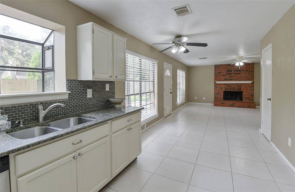 Kitchen looks out to the breakfast nook and family room.
