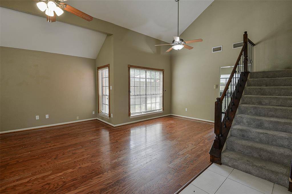 Upon entry you're welcomed by the living room, dining room, and staircase.