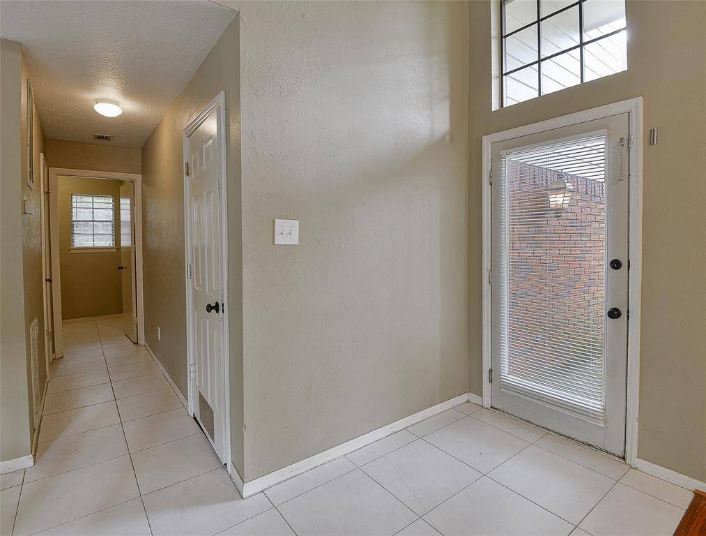 Laundry room and powder room are located as you enter from the garage.