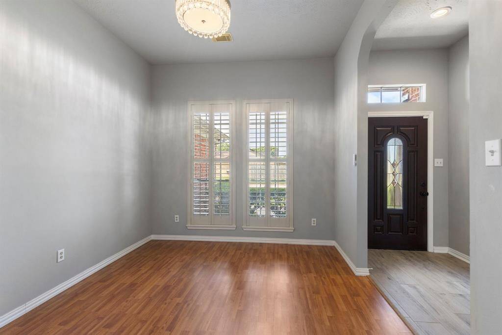 Elegant formal dining room with an open entryway is perfect for entertaining.