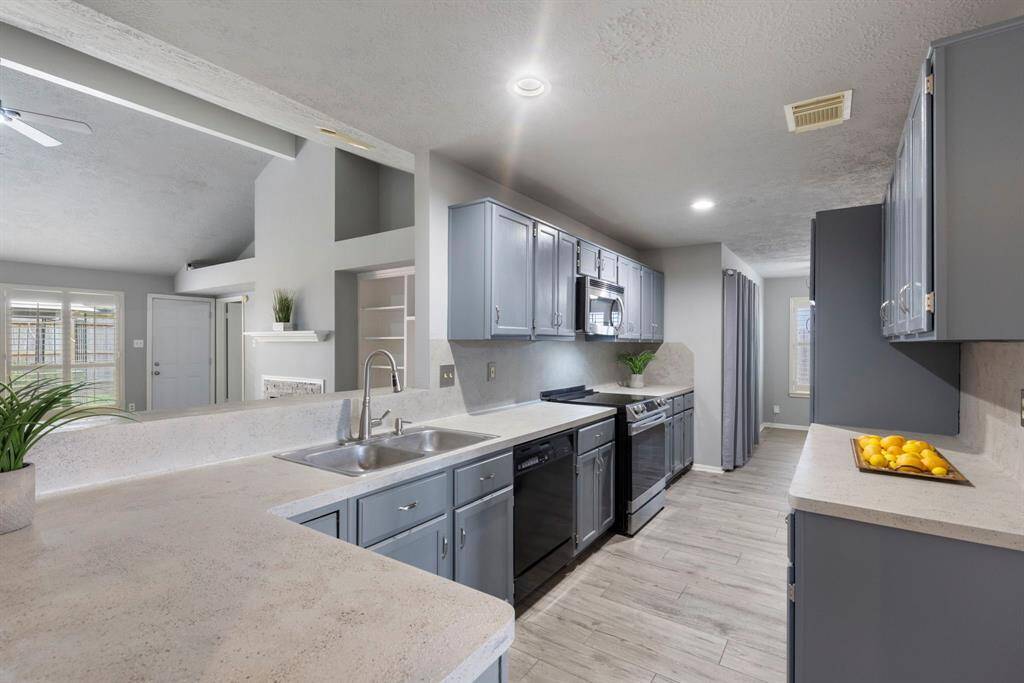 The kitchen offers an abundance of counter and cabinet space.