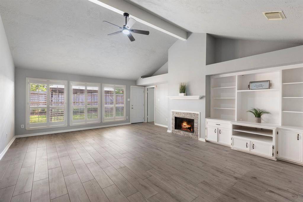 Enjoy the immense amount of natural light from the wall of windows in the living room.