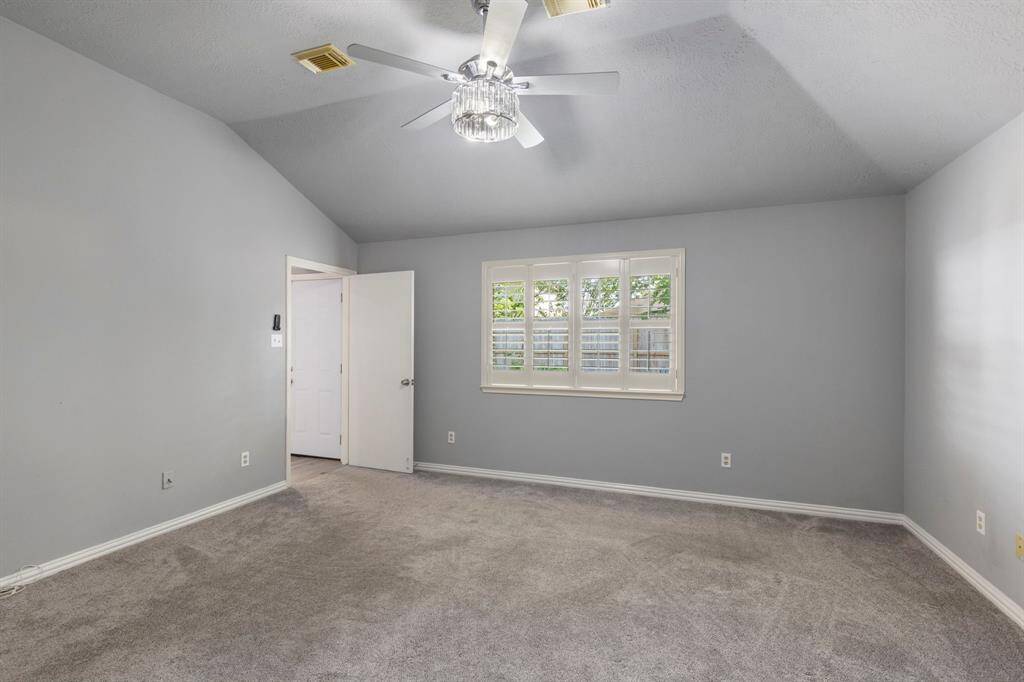 The luxurious primary suite provides ample space for a king size furniture set.