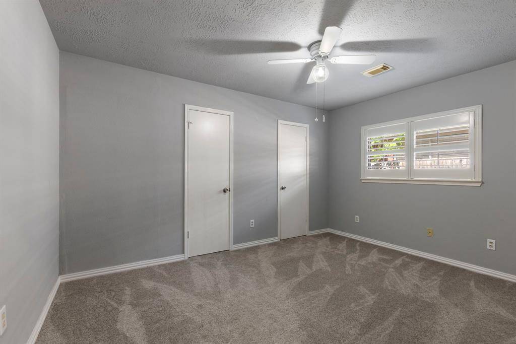 One of three roomy secondary bedrooms.