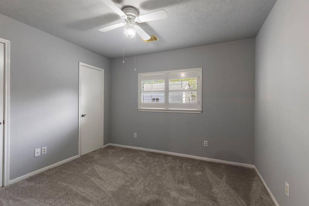 The third spare bedroom is comfortable in size and would make a perfect space for a play room, exercise room or a second study.