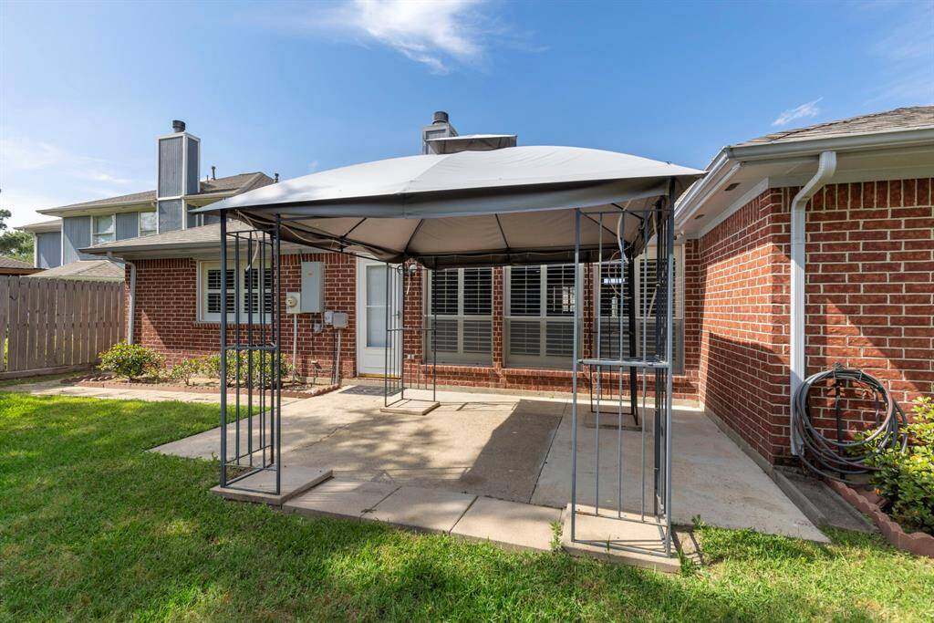 Enjoy relaxing under the shaded gazebo over the back patio.