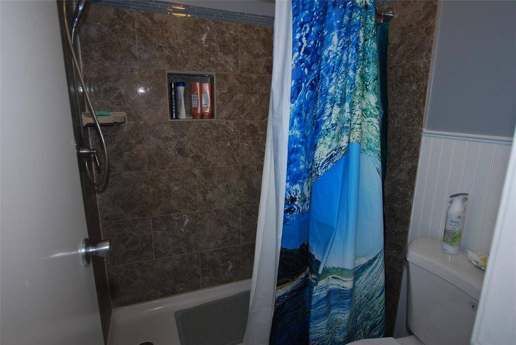 Bath has walk-in shower.