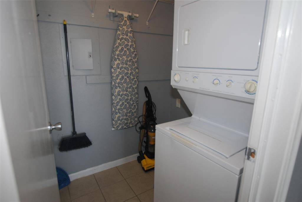Large utility room with lots of space for storage.  Washer and dryer stay with the condo.