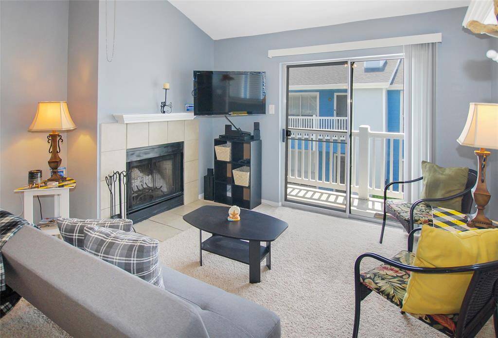 Living room has access to a small balcony.