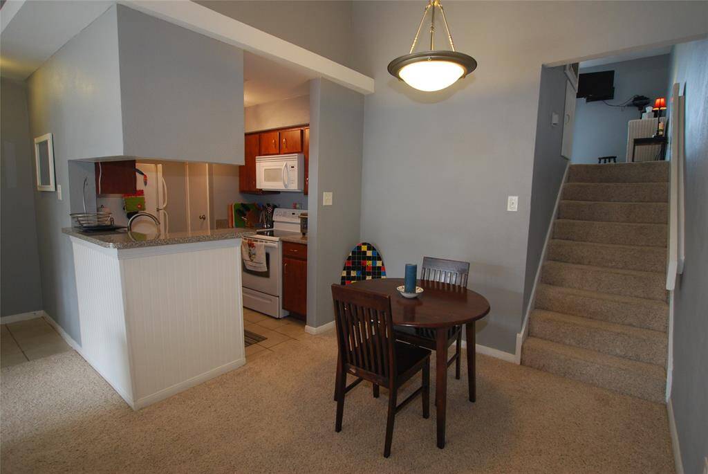 Separate dining area conveniently located off kitchen.