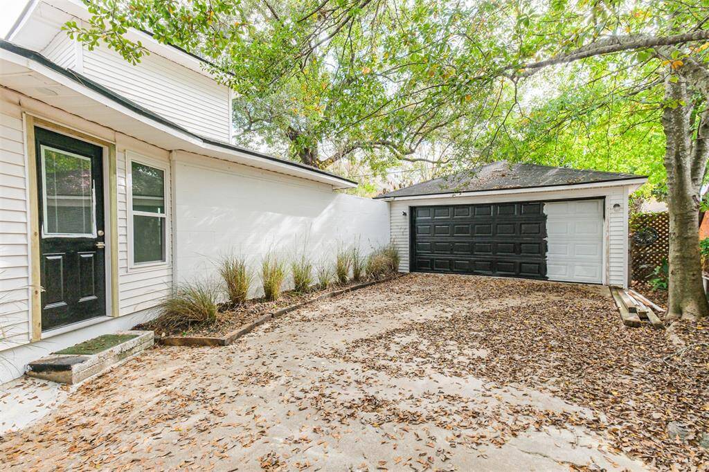 Driveway and garage.  [Painting will be completed soon.]