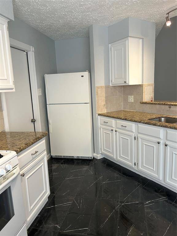 Door in kitchen goes out to garage