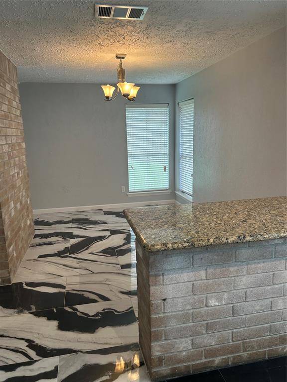 Formal dining area and another breakfast bar