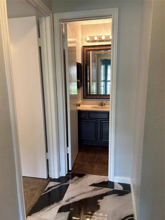 View from 2nd bedroom into hall and guest bathroom