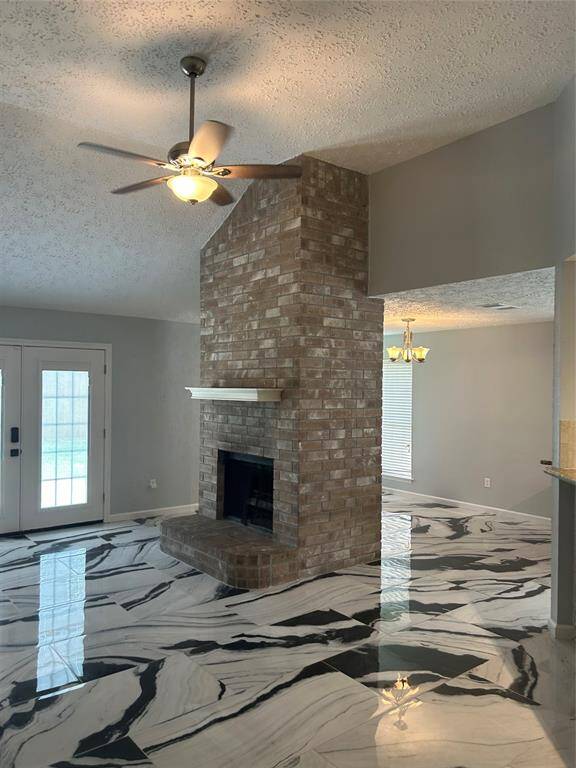Wood burning fireplace with gas starter in den