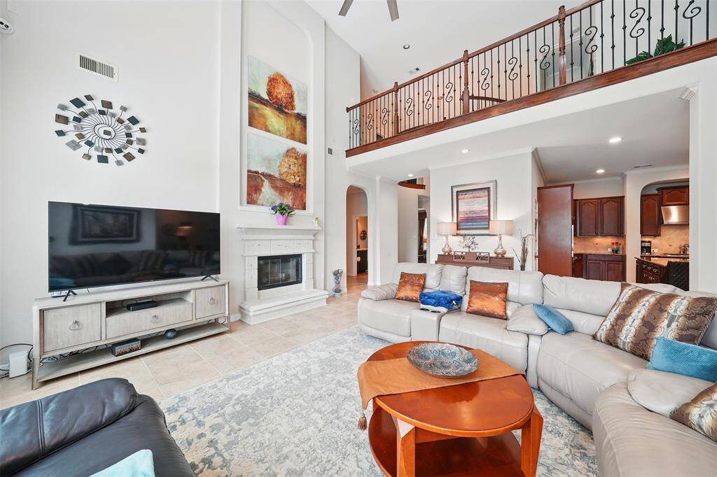 Large family entertainment space with a warm fireplace
