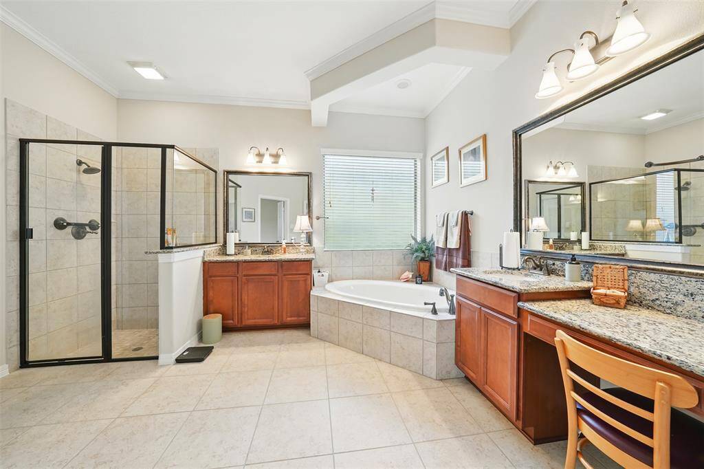 Primary bathroom with double sinks, and upgraded shower room
