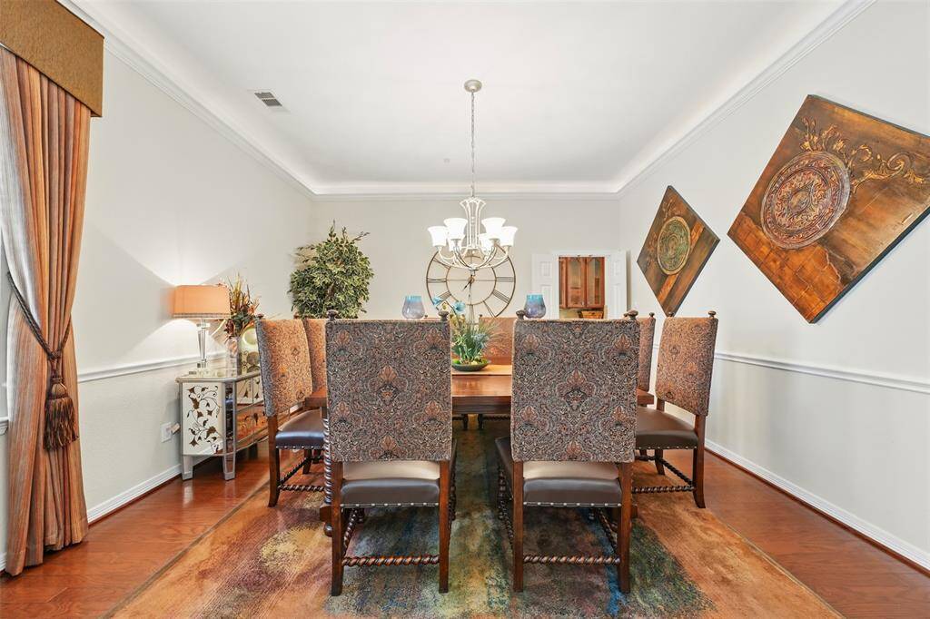 The formal dining room is well decorated and cozy