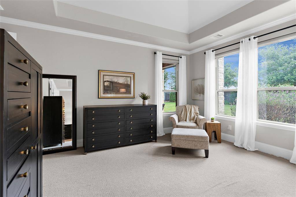 Another view of the spacious and bright master bedroom.