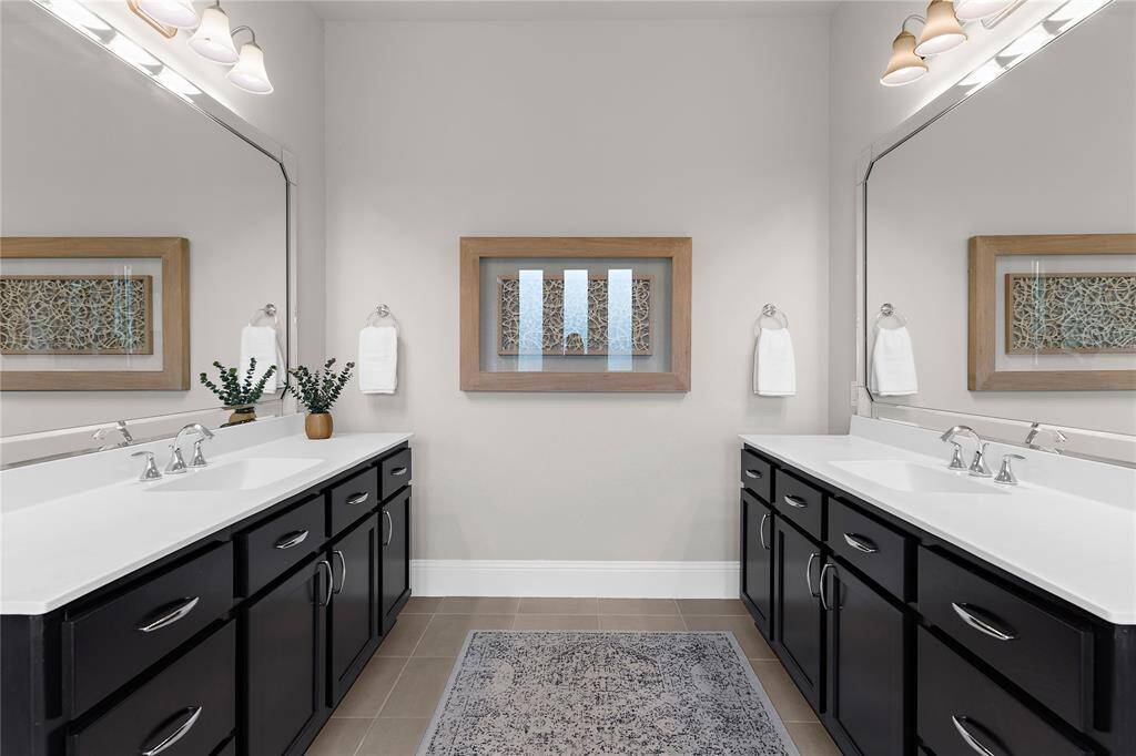 Enjoy having your own sink, counter space, storage and mirror in this primary bathroom.
