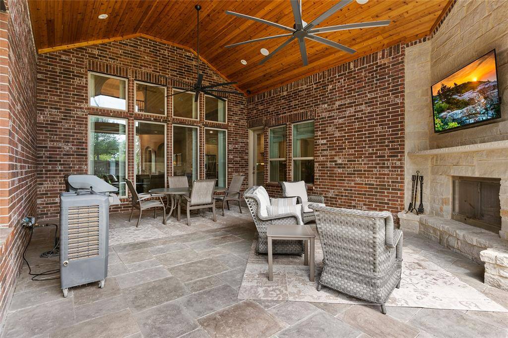 This patio has gorgeous tongue and groove cedar ceiling. As well as a large outdoor gas starting wood burning fire place. Lots of memories will be made!