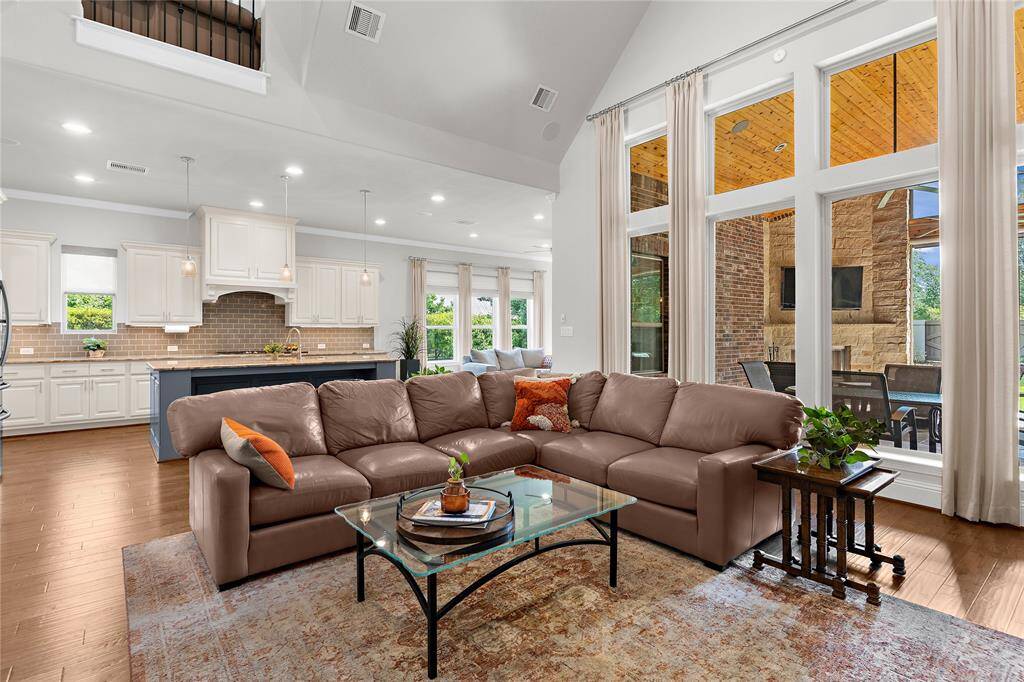Another view of the living room which shows the outstanding view of the exceptional back patio.
