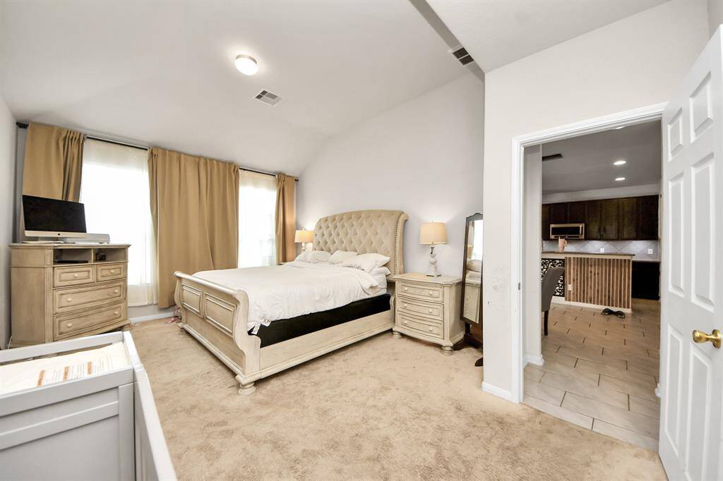 Generously sized primary bedroom offering a serene retreat with plenty of space for relaxation and personalization.