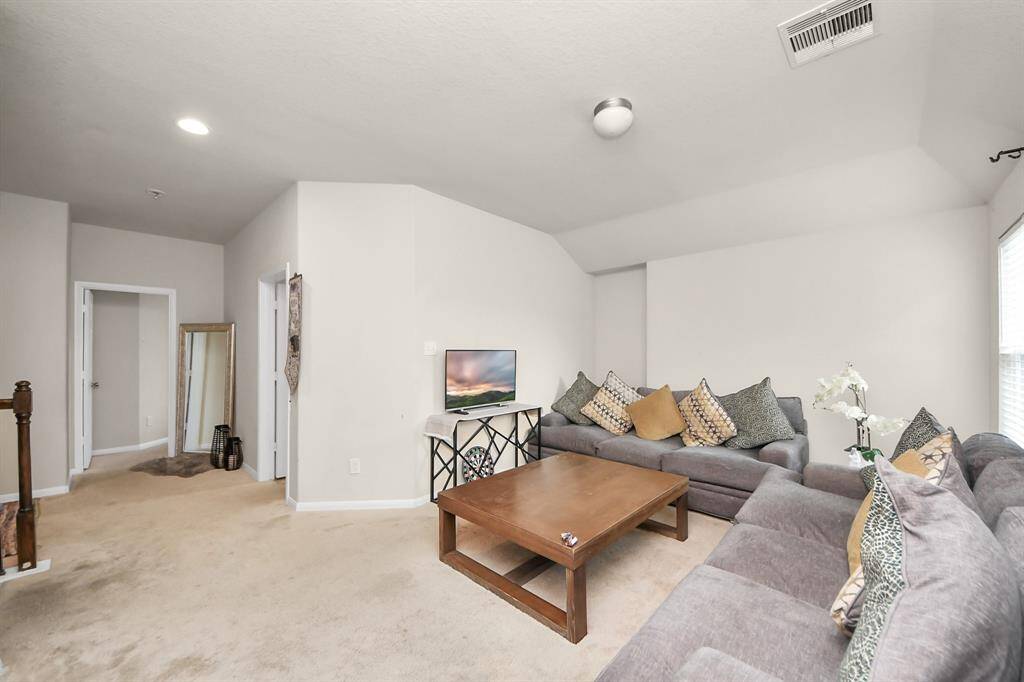 Spacious 2nd-floor flex space, perfect for a game room or second living area to suit your needs.