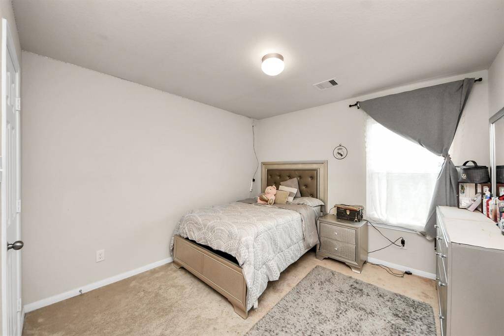 Bedroom 3 features a walk-in closet, offering ample storage.