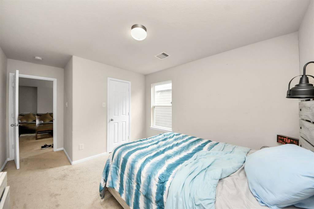 Bedroom 4 features a walk-in closet, offering ample storage.
