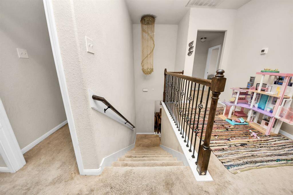 Overlooking view from the 2nd floor to the 1st, showcasing the spacious layout.