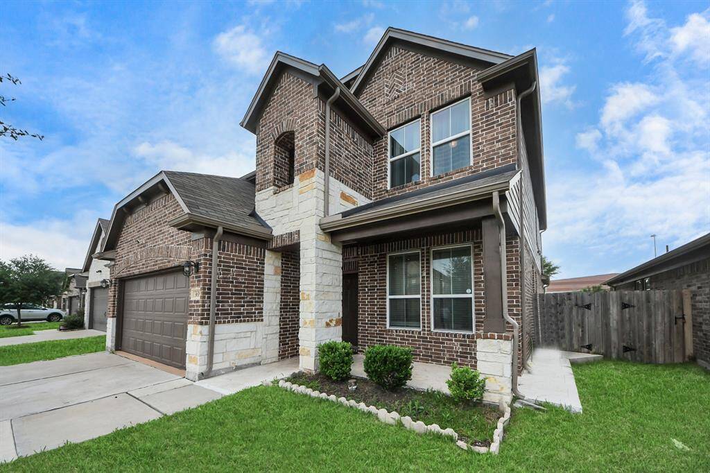The charming front porch offers the perfect spot to unwind, welcome guests, and enjoy the neighborhood ambiance.