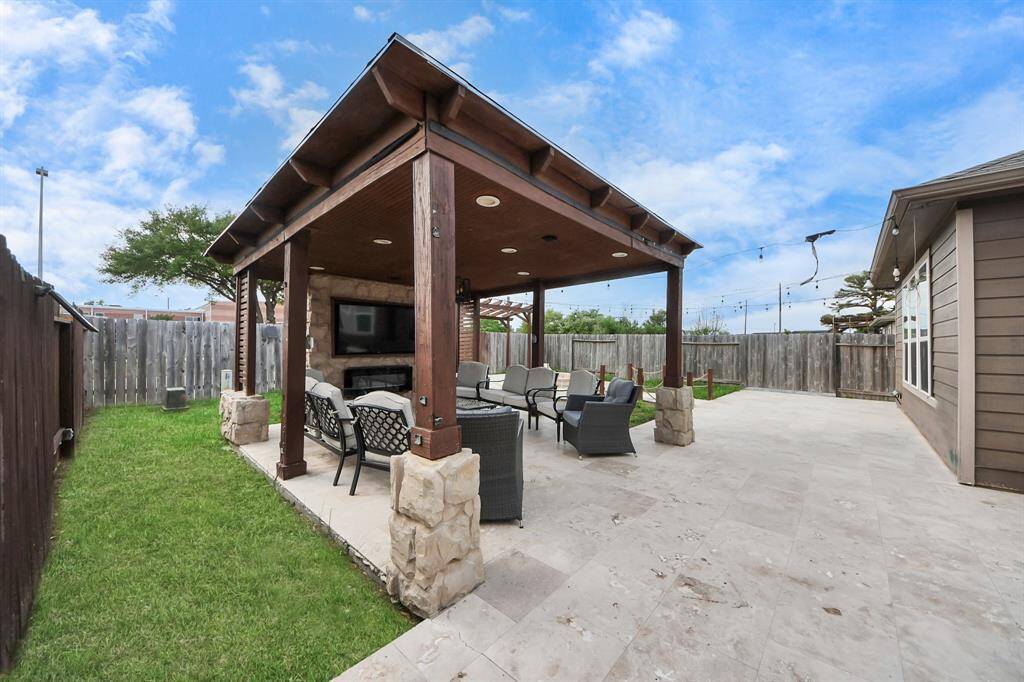 Backyard oasis, thoughtfully updated by the seller to create the perfect space for relaxation and entertaining