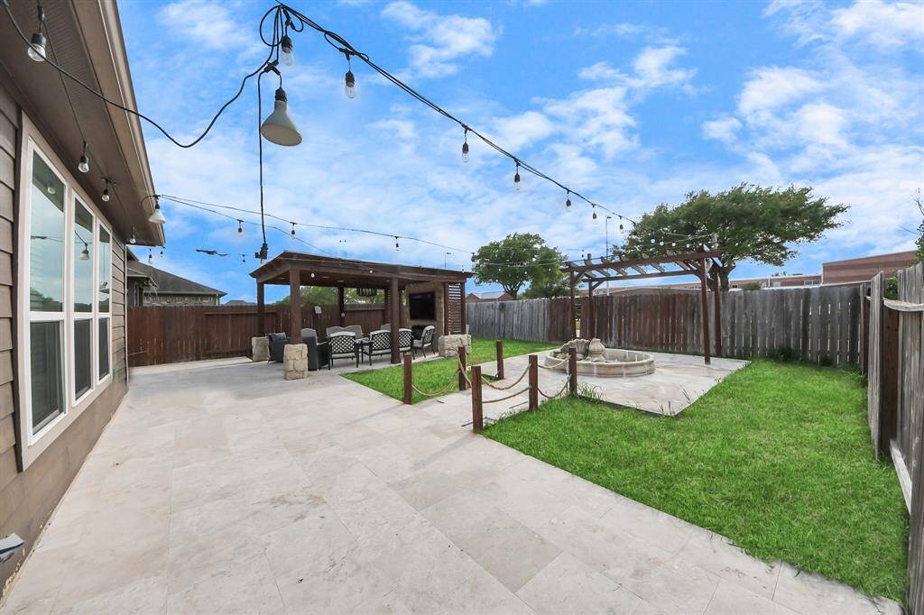 Backyard oasis, thoughtfully updated by the seller to create the perfect space for relaxation and entertaining