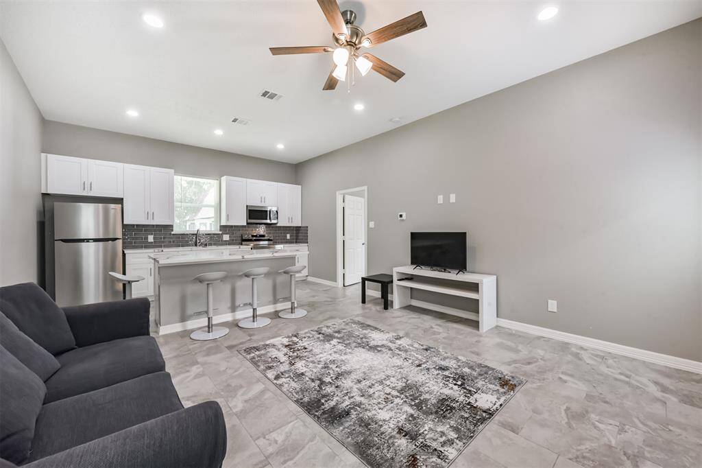 Spacious guest house living area with private entrance