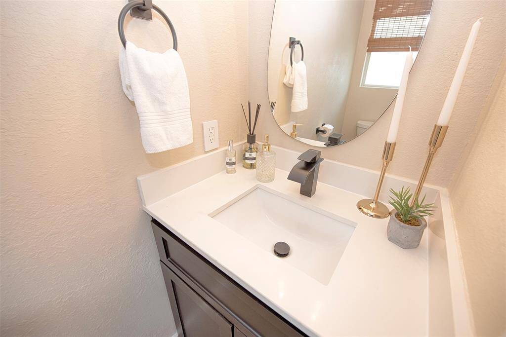 Next to the utility room is a downstairs half bath.