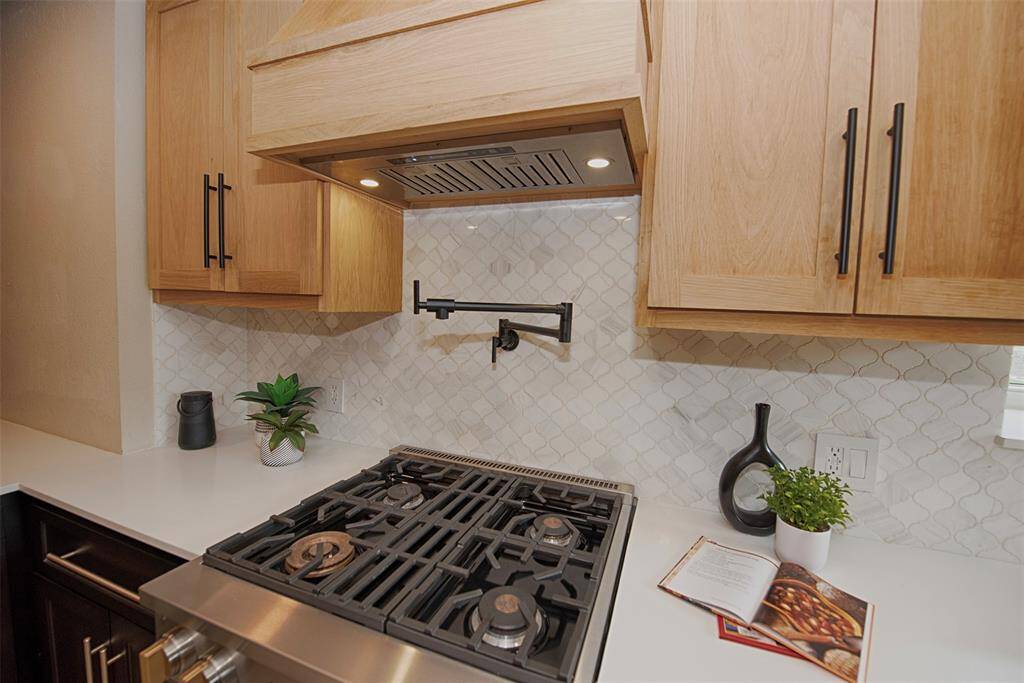 A view of the fabulous gas range. One of the burners provides for Wok style cooking.