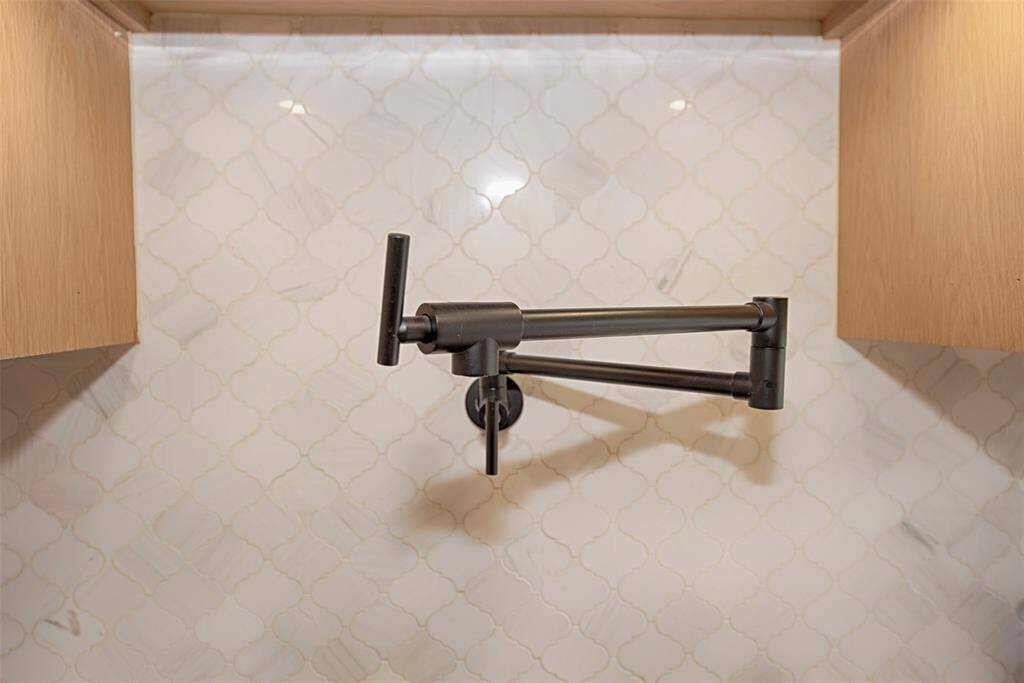 Above the stove there is even a pot filler. This kitchen is a chef's dream come true.