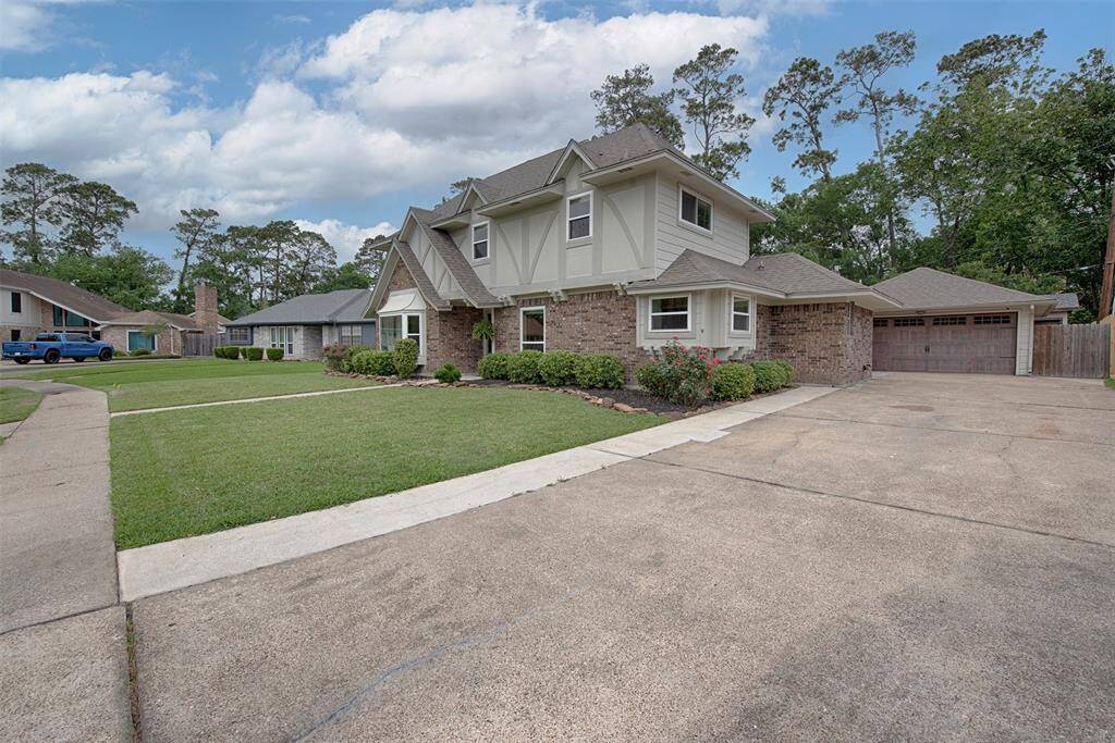Home provides extra long driveway to the detached garage. Great additional parking for your guests when entertaining.