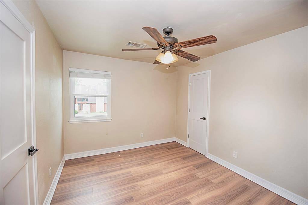Another fabulous bedroom for your guests with the gorgeous wood laminate floors and walk in closet.