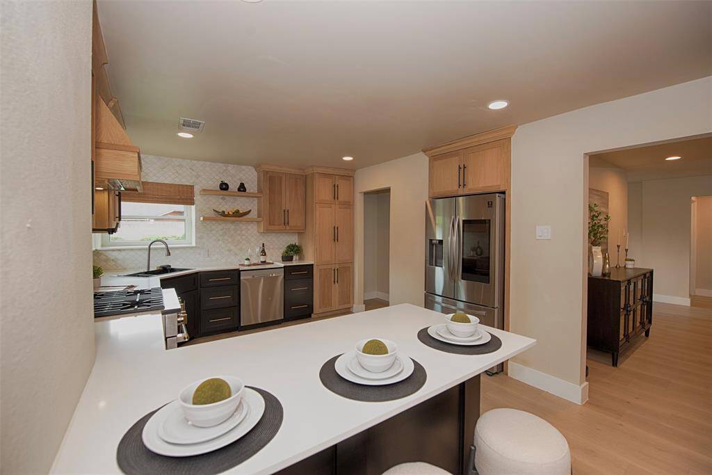 Another view of this spectacular kitchen with incredible updates.  There are even floating shelves.