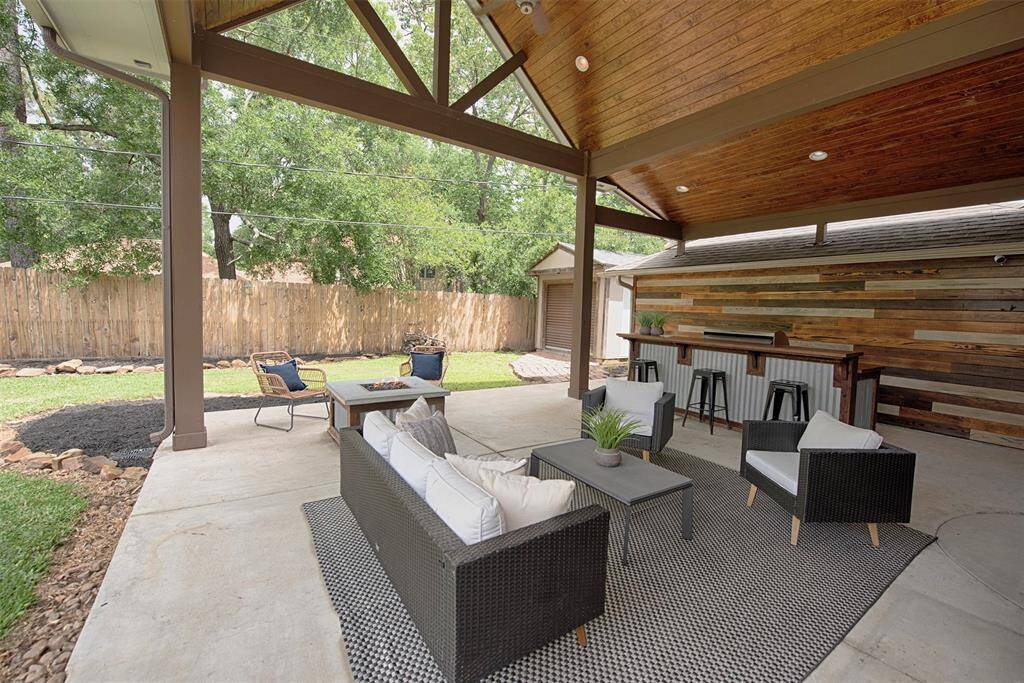 The perfect spot for outdoor dining or just relaxing in the evening with a favorite beverage. There is an amazing accent wall behind the grill as well.