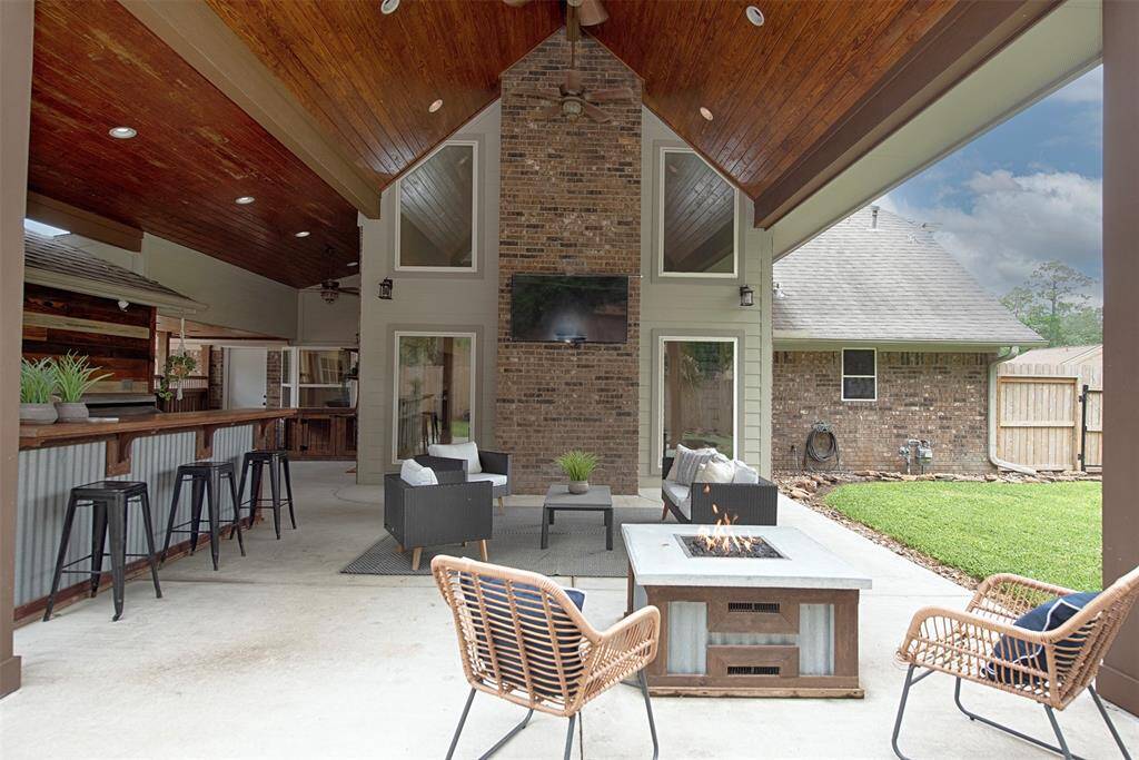The back patio even includes a fire pit to enjoy during the cooler evenings.