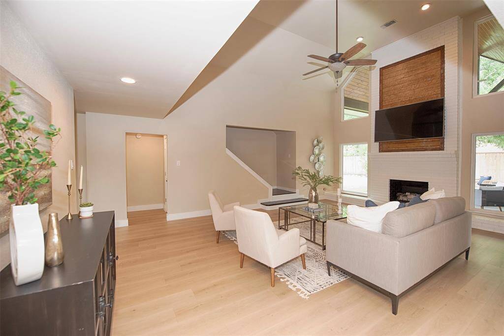 A view showing the gorgeous luxury vinyl floors and the great space in the family room as you approach the kitchen.