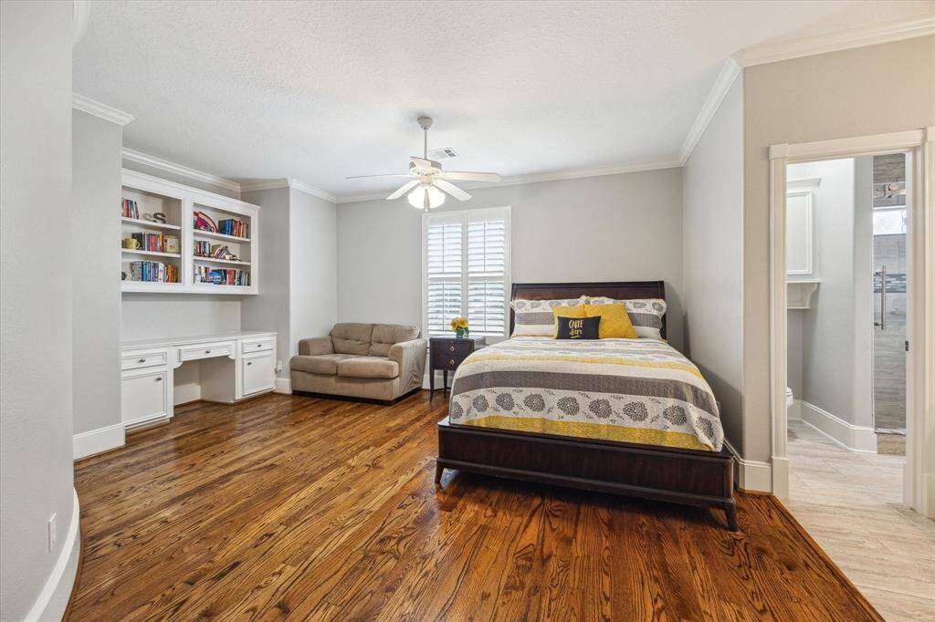 2nd bedroom with high ceilings, built-in desk and shelving. Separate vanity to Hollywood bath shared with 3rd bedroom.