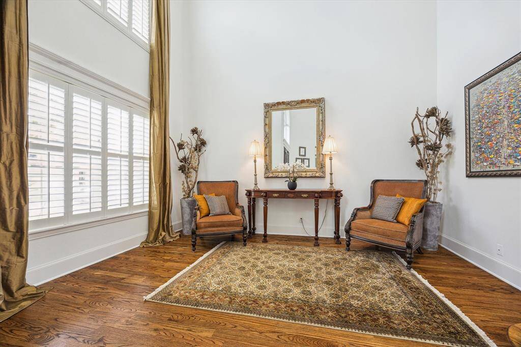Formal living room off of entry is accented with 2 story windows for natural light.