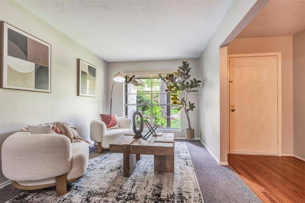 Formal living room looks out over front yard