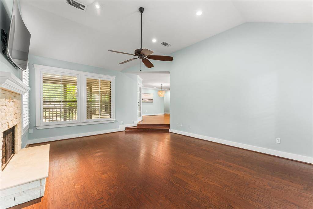 Step into the large yet so cozy living room with windows on 3 sides.